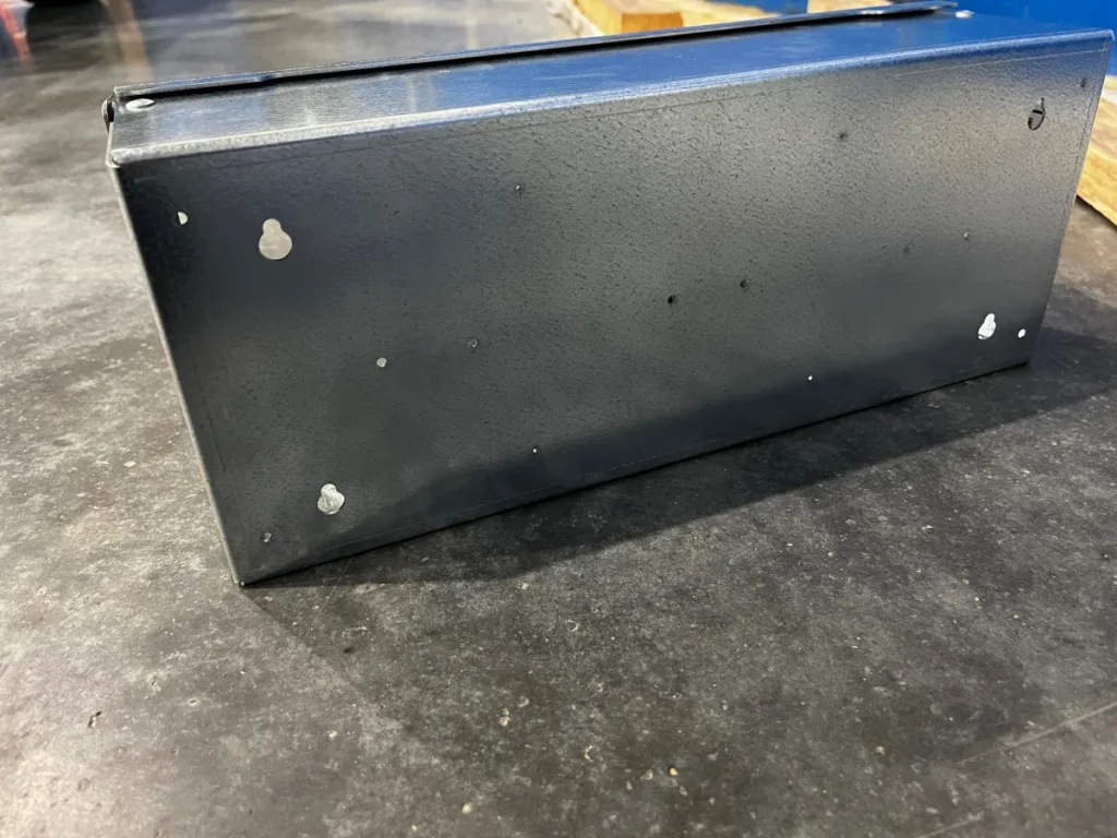 Rear of a TRU-BOX enclosure showing integrated keyhole wall mounts